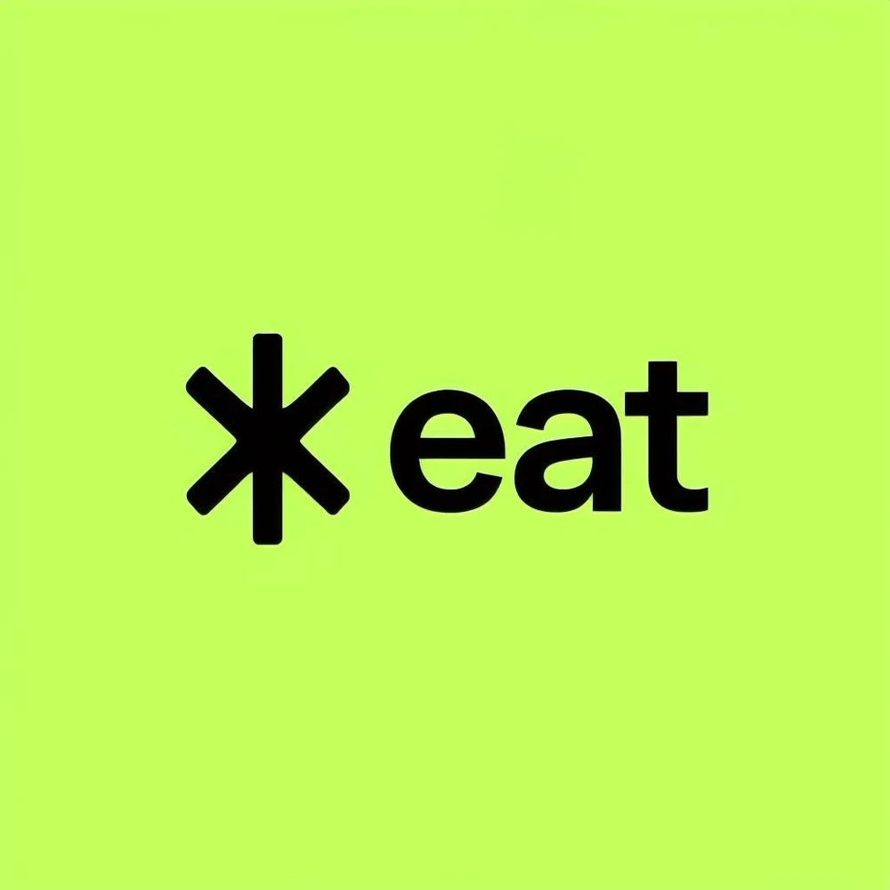 Минималистичный логотип eat на ярком зелёном фоне